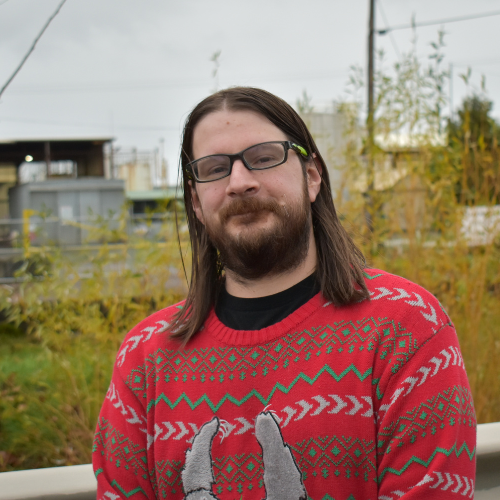 Kyle, a west Eugene man with long hair and a beard.