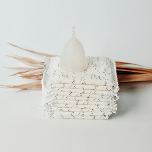 A stack of unused period pads.